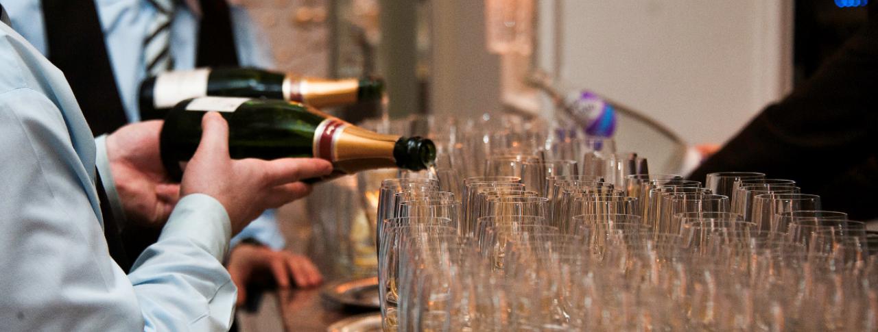 Champagne being poured into Glasses at Specialised Chef Graduation
