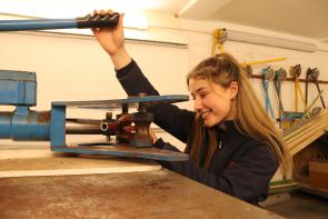 Roxanne, Plumbing and Heating Apprenticeship working in workshop